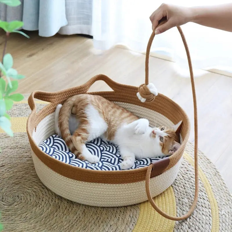 Khaki and white cat bed with ear-shaped design, thick woven scratching board and cozy pet bed by Fetch & Purr.