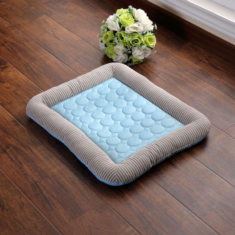 Soft Pet Cold Sense Cool Pad by Fetch & Purr on pet zone surface, designed to keep pets cool and comfortable.