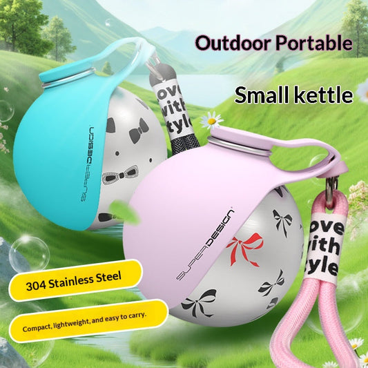 Portable Fetch & Purr dog water bottle with built-in bowl for easy hydration during walks and outdoor activities.