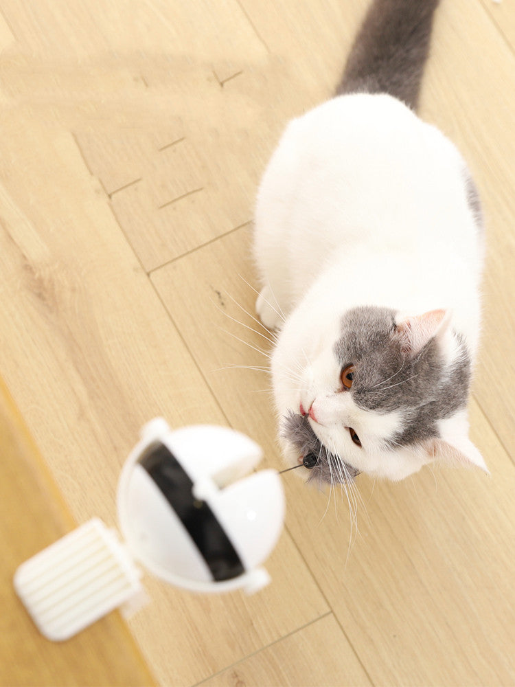 Fetch & Purr smart interactive electric cat teaser toy with moving feather attachment for playful feline entertainment.
